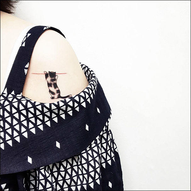 татуировка в виде кошки